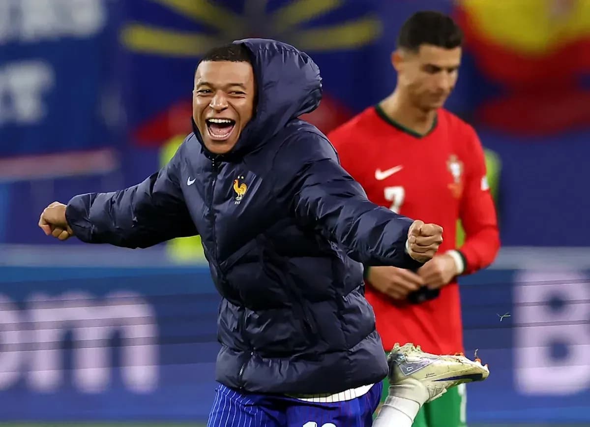 Kylian Mbappé celebrating during match, Cristiano Ronaldo in background Kylian Mbappé celebrating during match, Cristiano Ronaldo in background