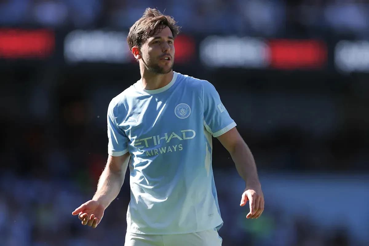 Player in light blue jersey on football pitch Player in light blue jersey on football pitch