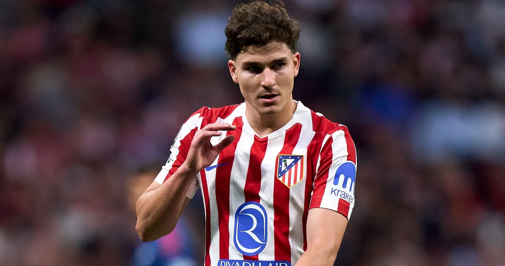 Atletico Madrid player gesturing during a match Atletico Madrid player gesturing during a match