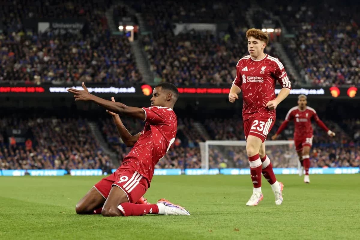 Liverpool players celebrating a goal on the pitch Liverpool players celebrating a goal on the pitch