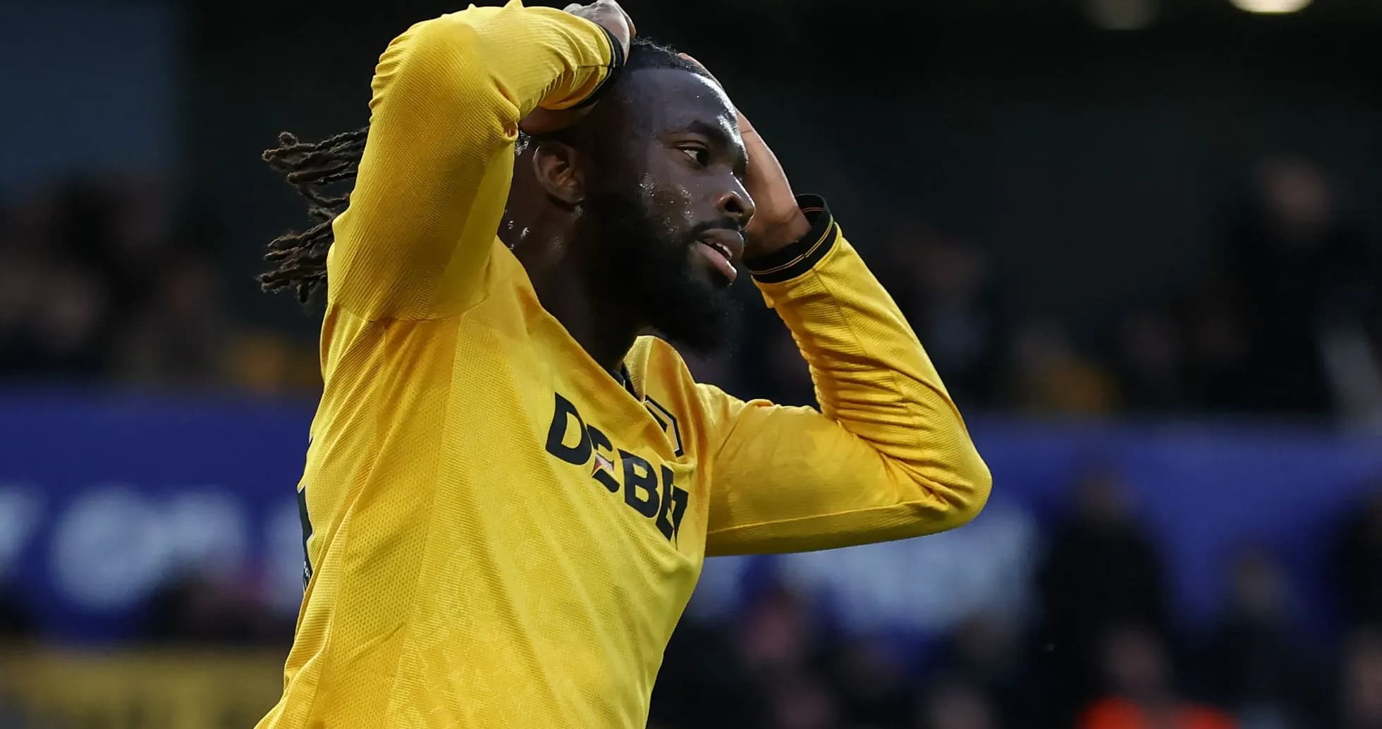 Player in yellow jersey reacting after missed opportunity Player in yellow jersey reacting after missed opportunity