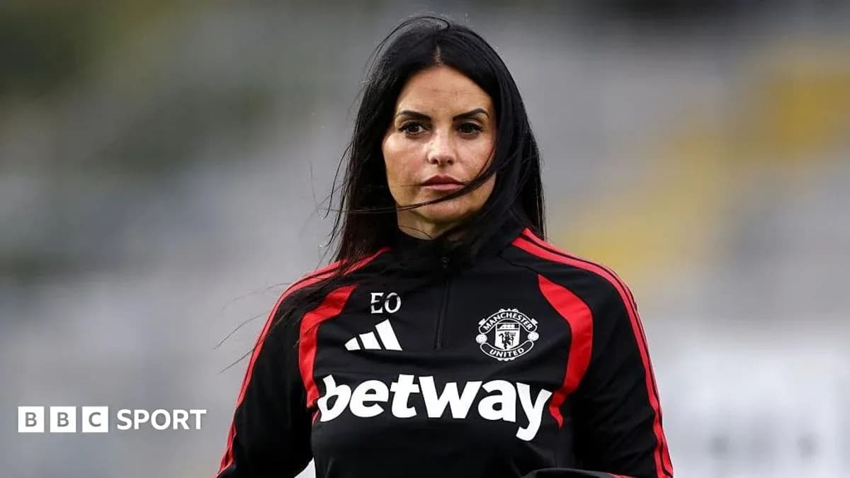 Coach wearing Manchester United training gear outdoors Coach wearing Manchester United training gear outdoors