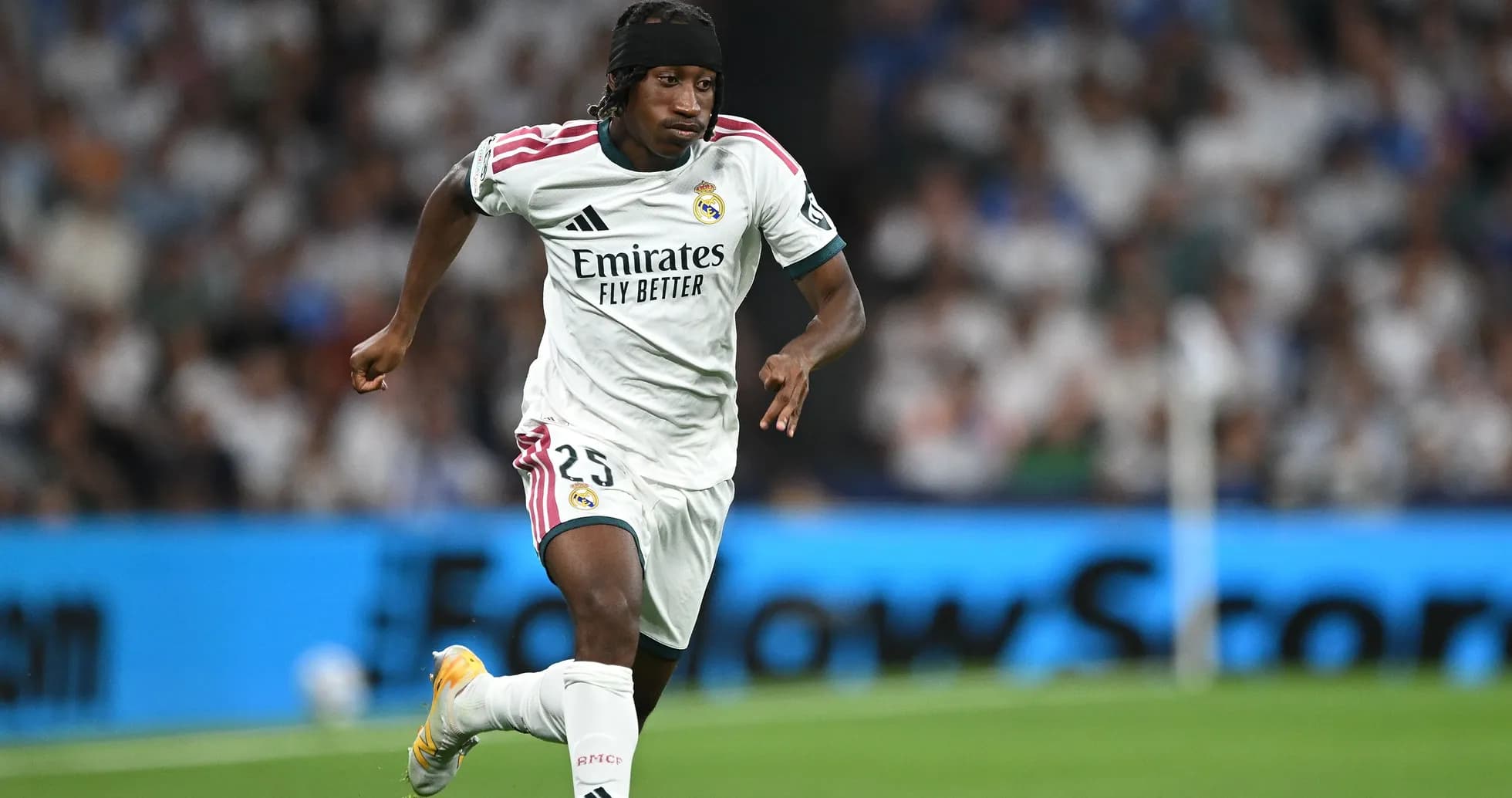 Player running with ball during match for Real Madrid Player running with ball during match for Real Madrid