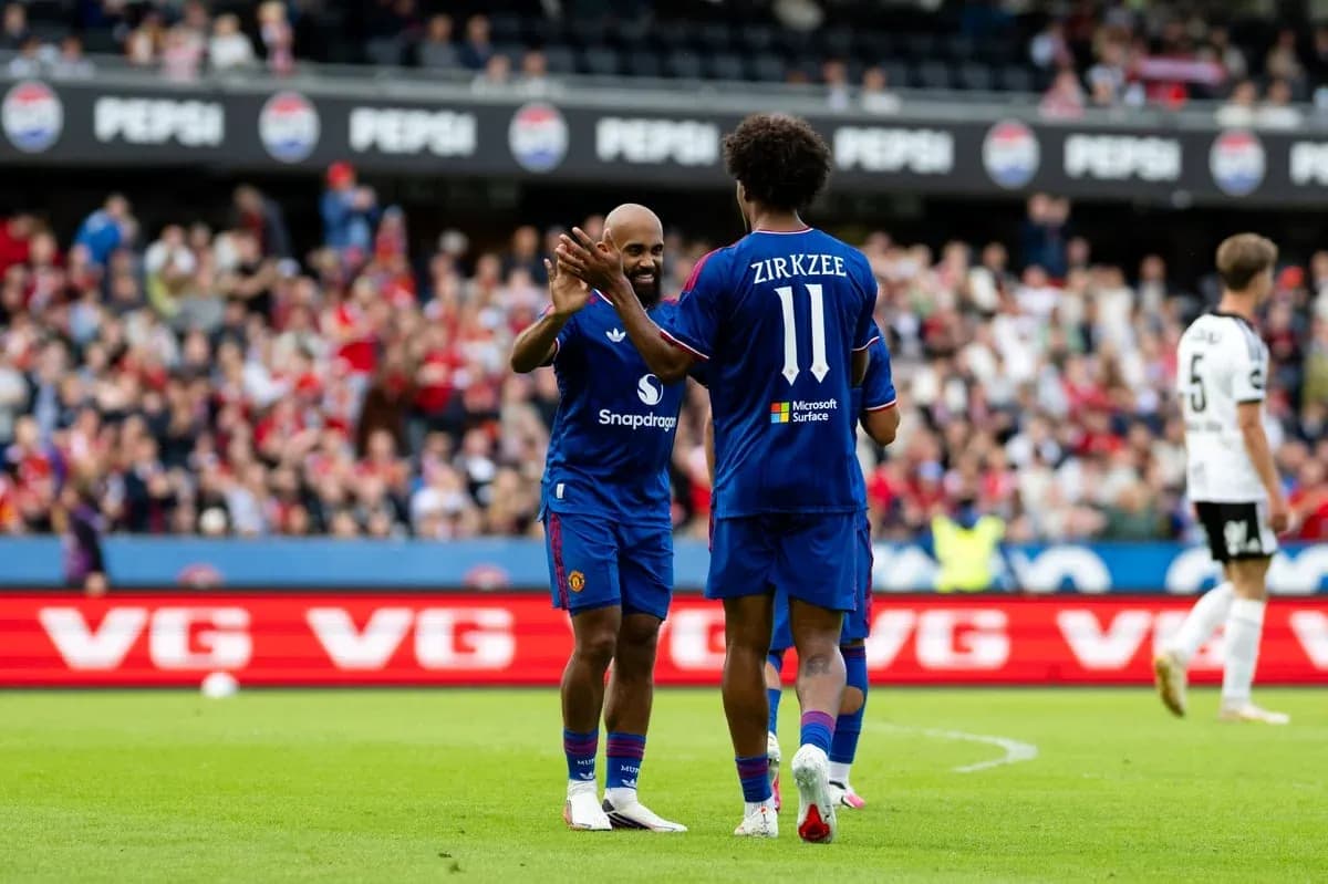 Players celebrating on the field during match Players celebrating on the field during match