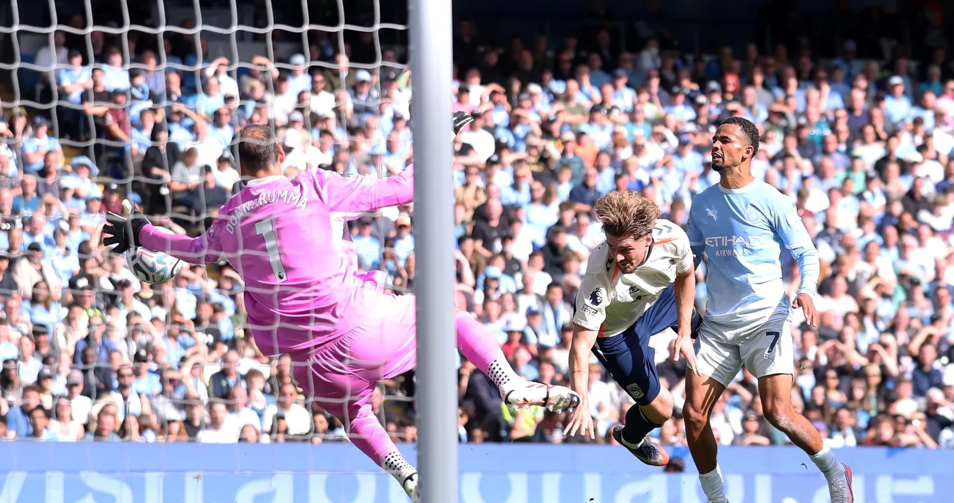 Goalkeeper making a save during a match Goalkeeper making a save during a match