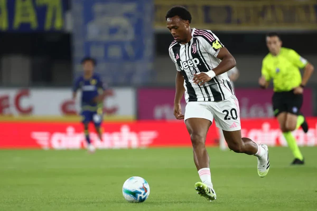 Juventus player dribbling ball during match Juventus player dribbling ball during match