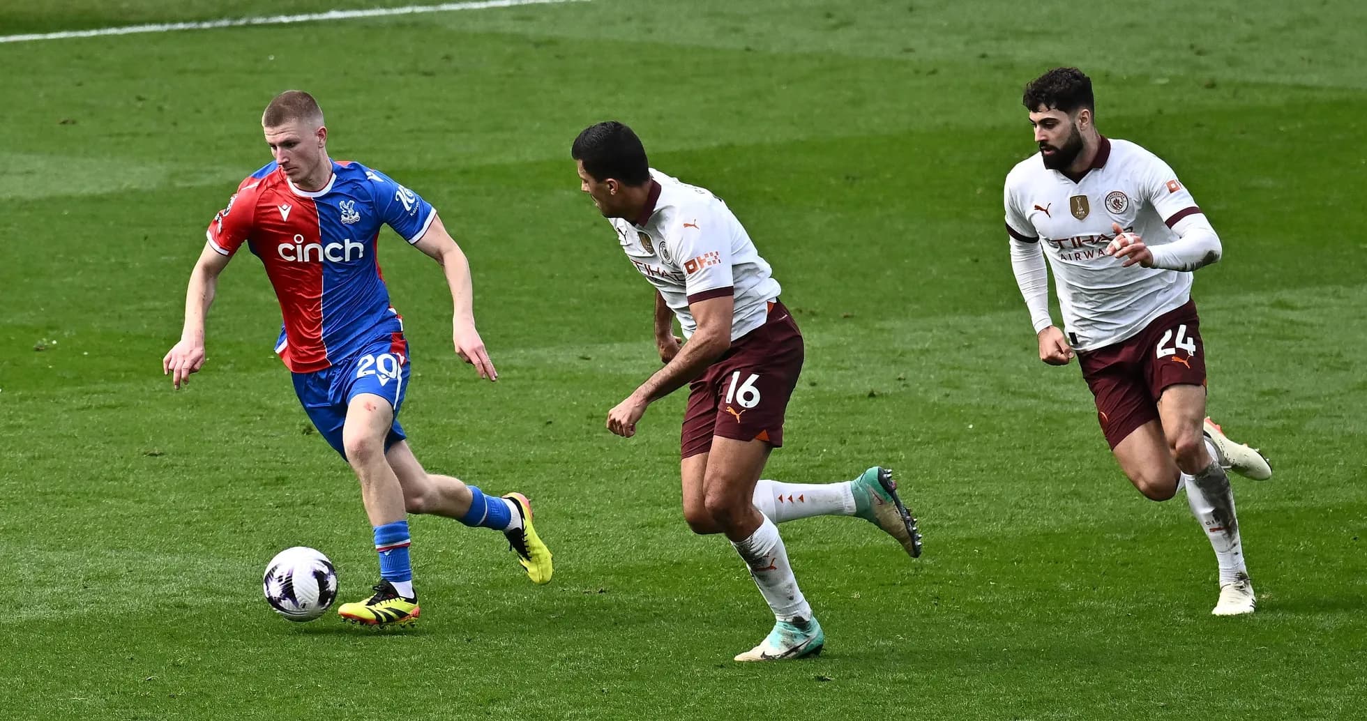 Player dribbling the ball with defenders chasing Player dribbling the ball with defenders chasing