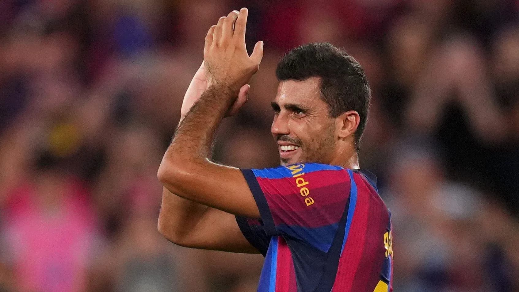 Player applauding fans during a match celebration Player applauding fans during a match celebration