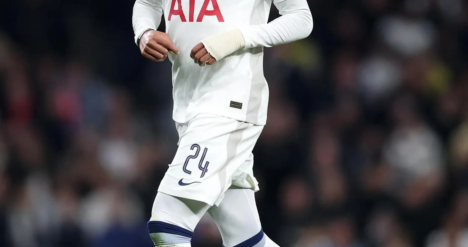 Player in Tottenham kit running with ball Player in Tottenham kit running with ball
