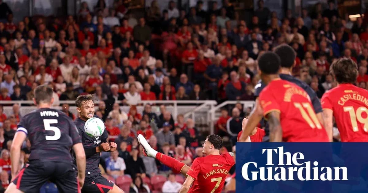 Player attempting a shot during football match action Player attempting a shot during football match action