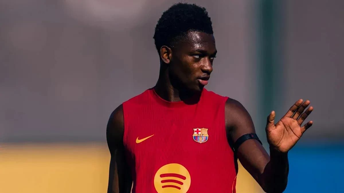 Player in Barcelona training kit gesturing on field Player in Barcelona training kit gesturing on field