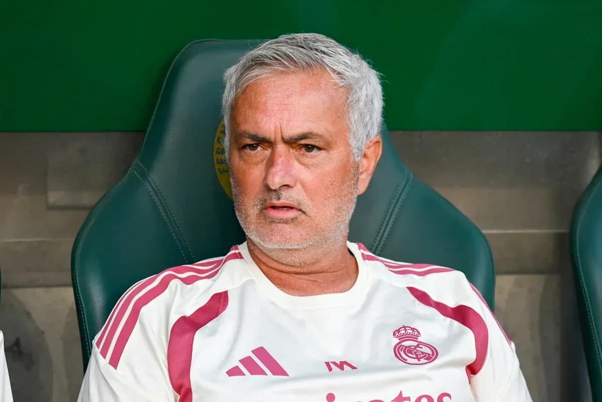 Coach sitting on bench during match Coach sitting on bench during match