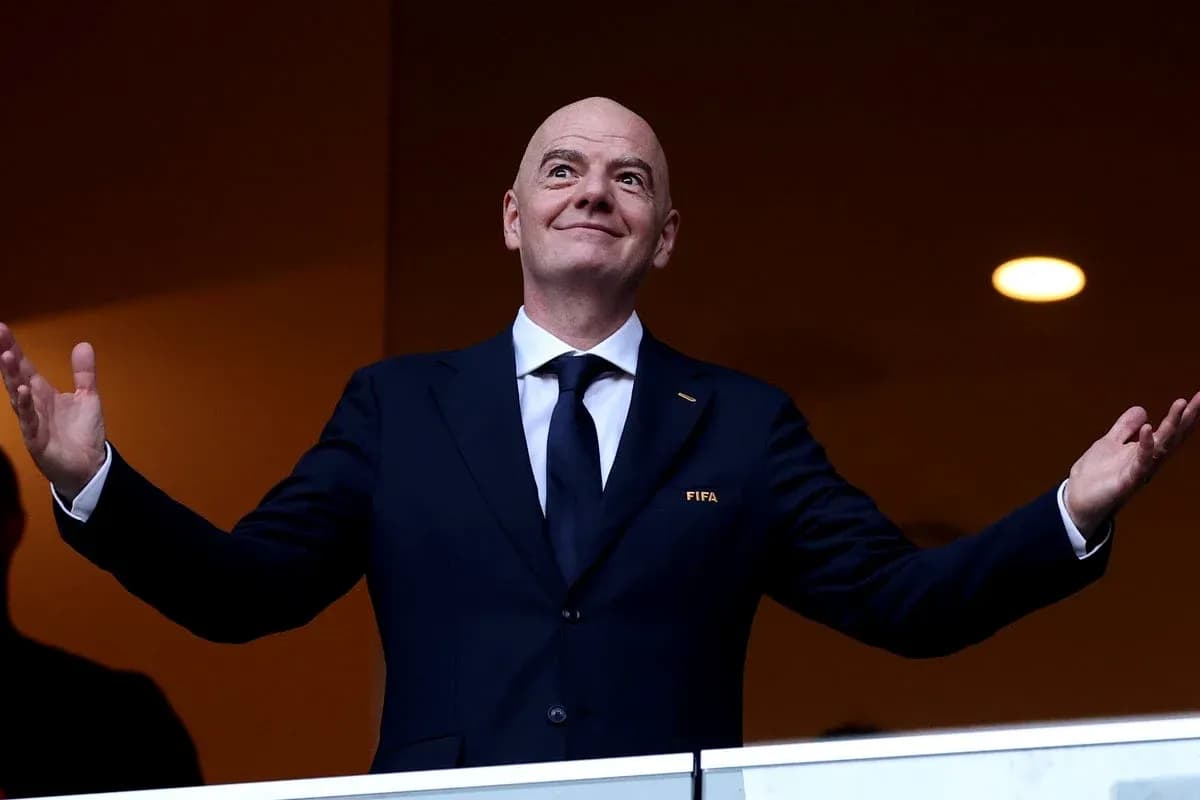 FIFA president gesturing from VIP box at event FIFA president gesturing from VIP box at event