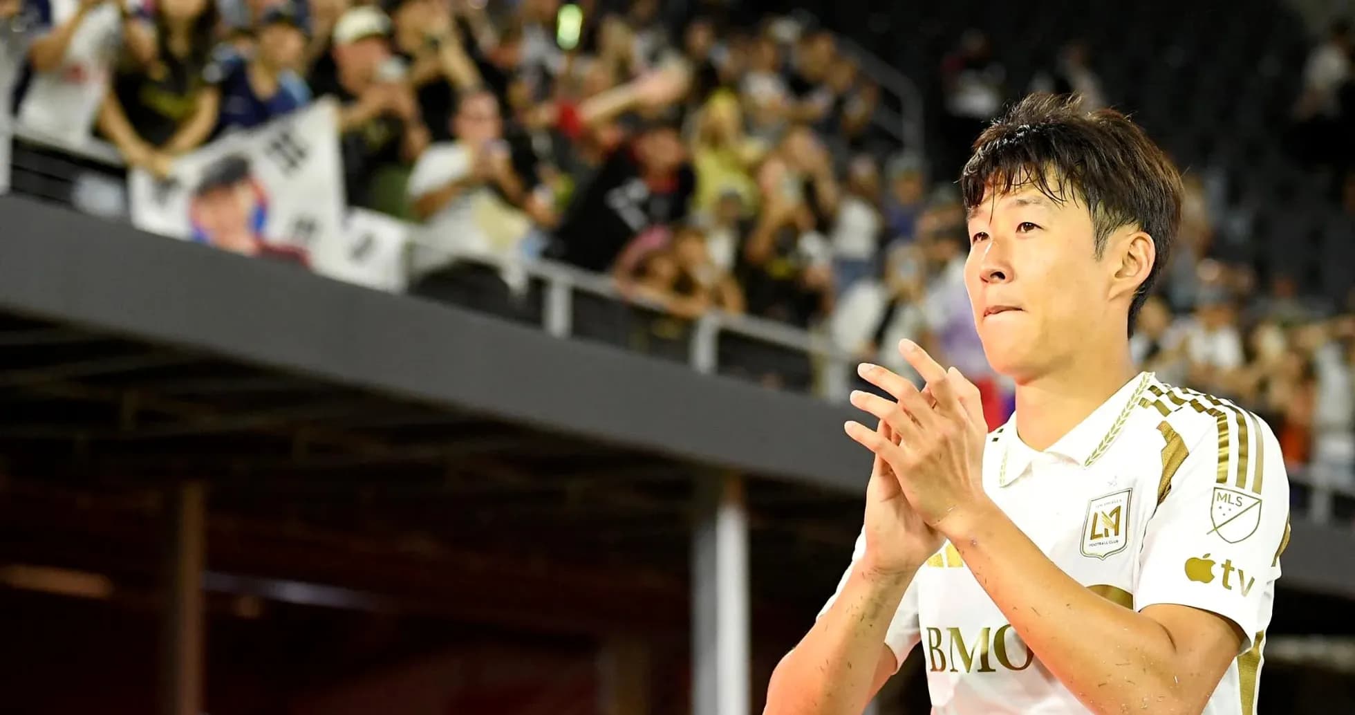 Player applauding fans during match celebration Player applauding fans during match celebration