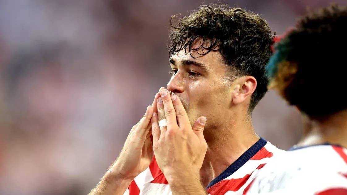 Player celebrating with hands near face during match Player celebrating with hands near face during match