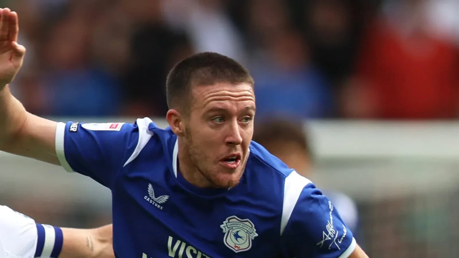 Player in blue jersey running during match Player in blue jersey running during match