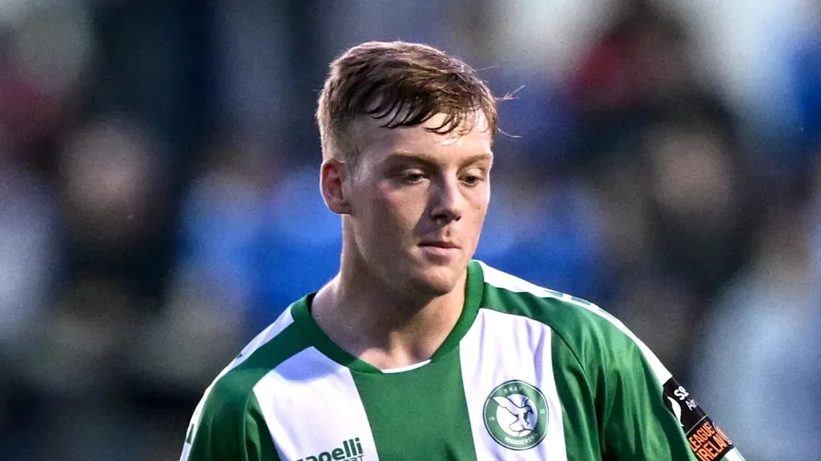 Player in green and white kit during match Player in green and white kit during match