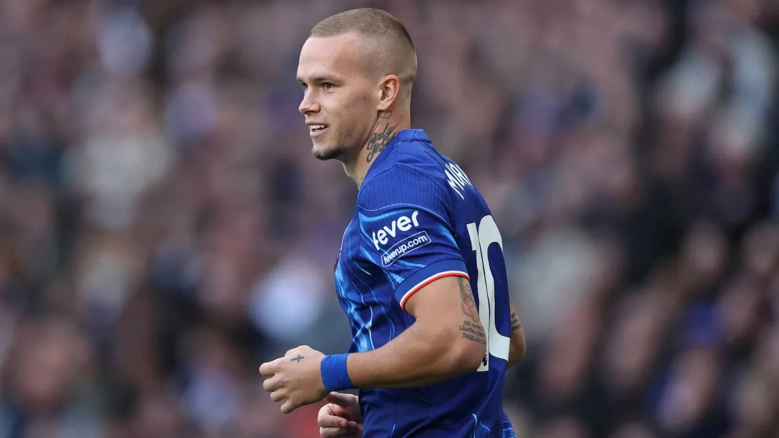 Player wearing blue jersey during a match Player wearing blue jersey during a match