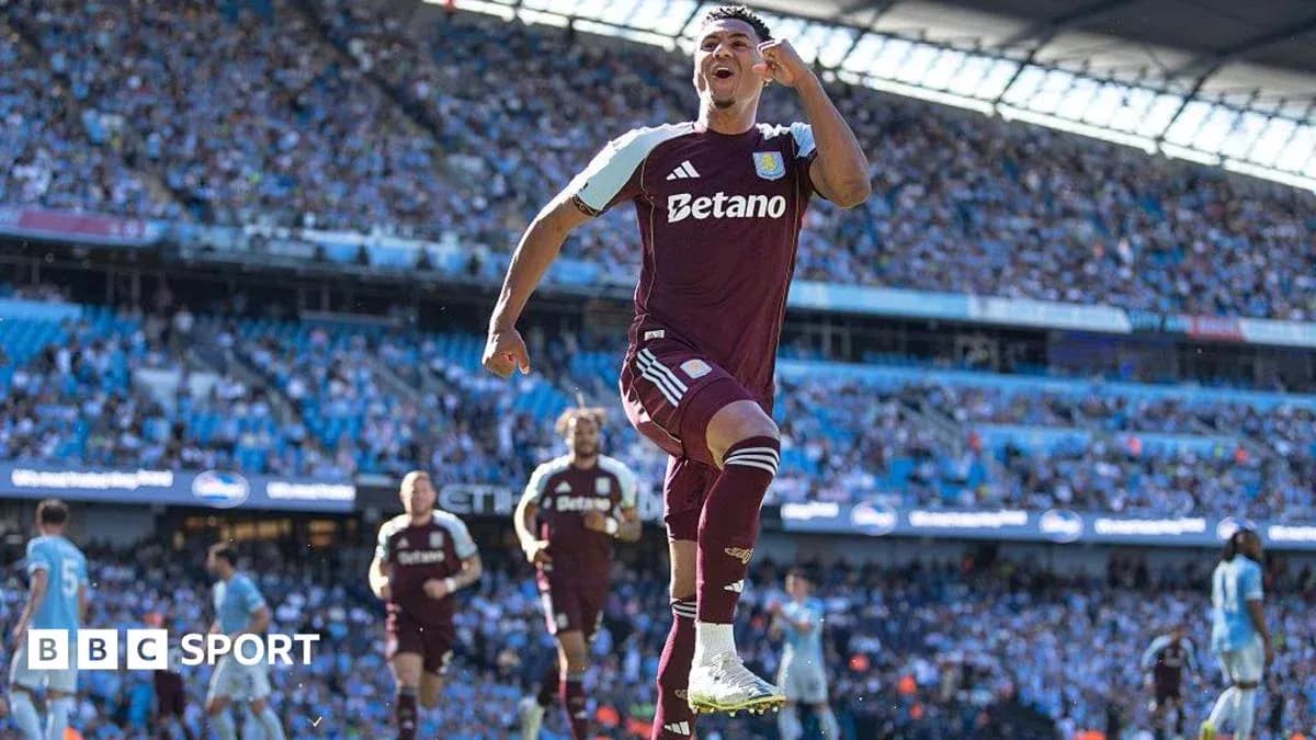 Aston Villa player celebrating in front of fans Aston Villa player celebrating in front of fans