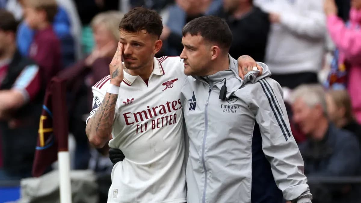 Player receiving support from staff after match Player receiving support from staff after match