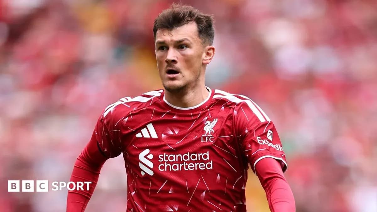 Liverpool player in red kit during match action Liverpool player in red kit during match action
