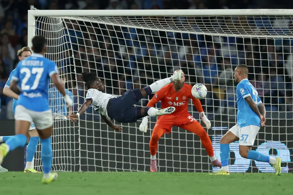 Player executing a bicycle kick in match Player executing a bicycle kick in match