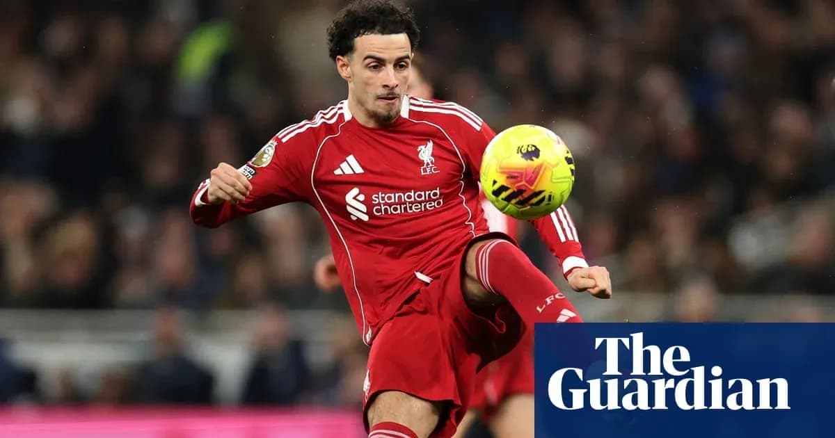 Liverpool player controlling ball during match action Liverpool player controlling ball during match action