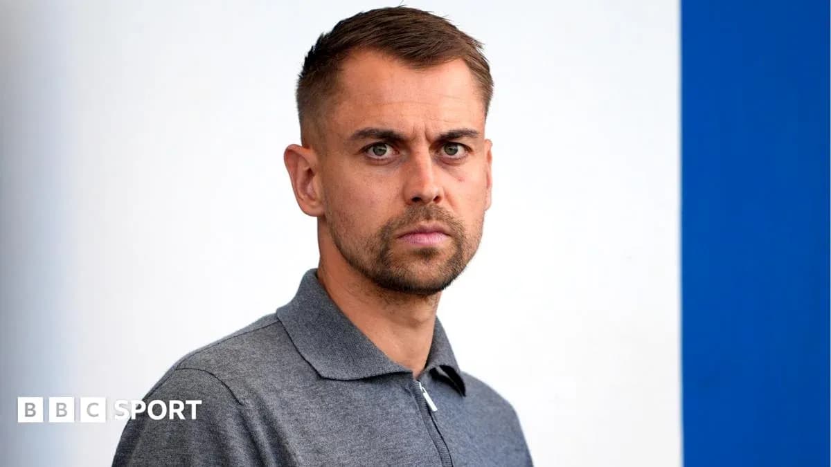 Man in gray polo shirt posing for photo Man in gray polo shirt posing for photo