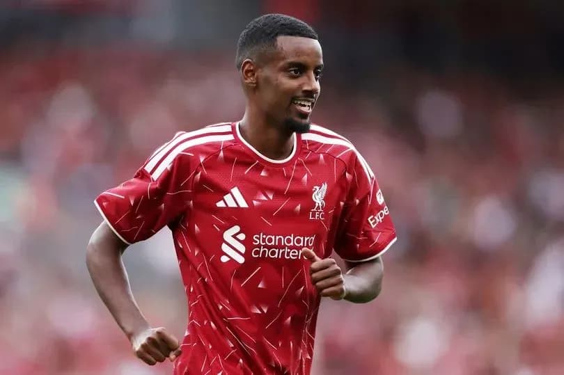 Player celebrating in Liverpool FC red jersey Player celebrating in Liverpool FC red jersey