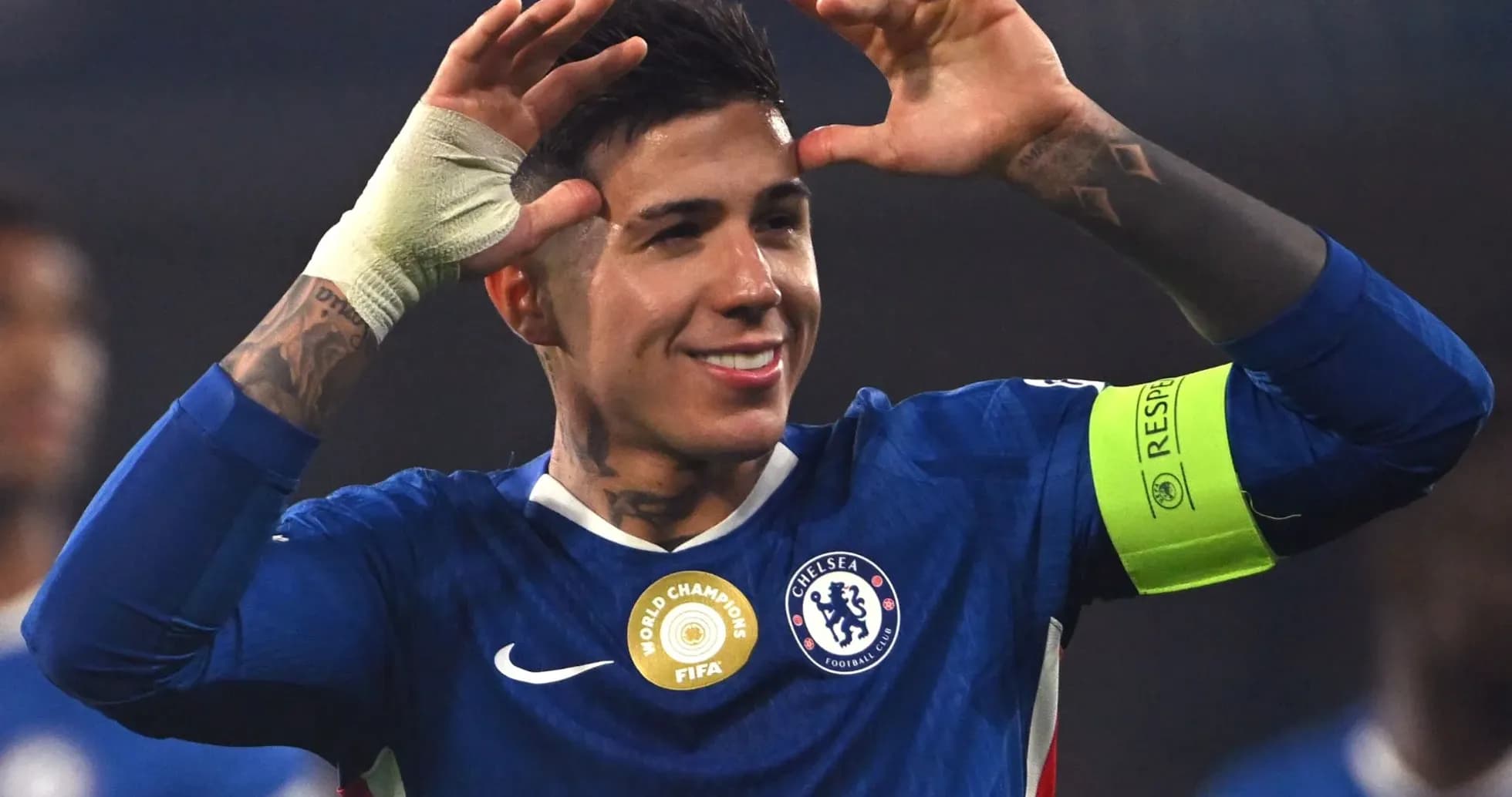 Player celebrating with arms raised in Chelsea kit Player celebrating with arms raised in Chelsea kit