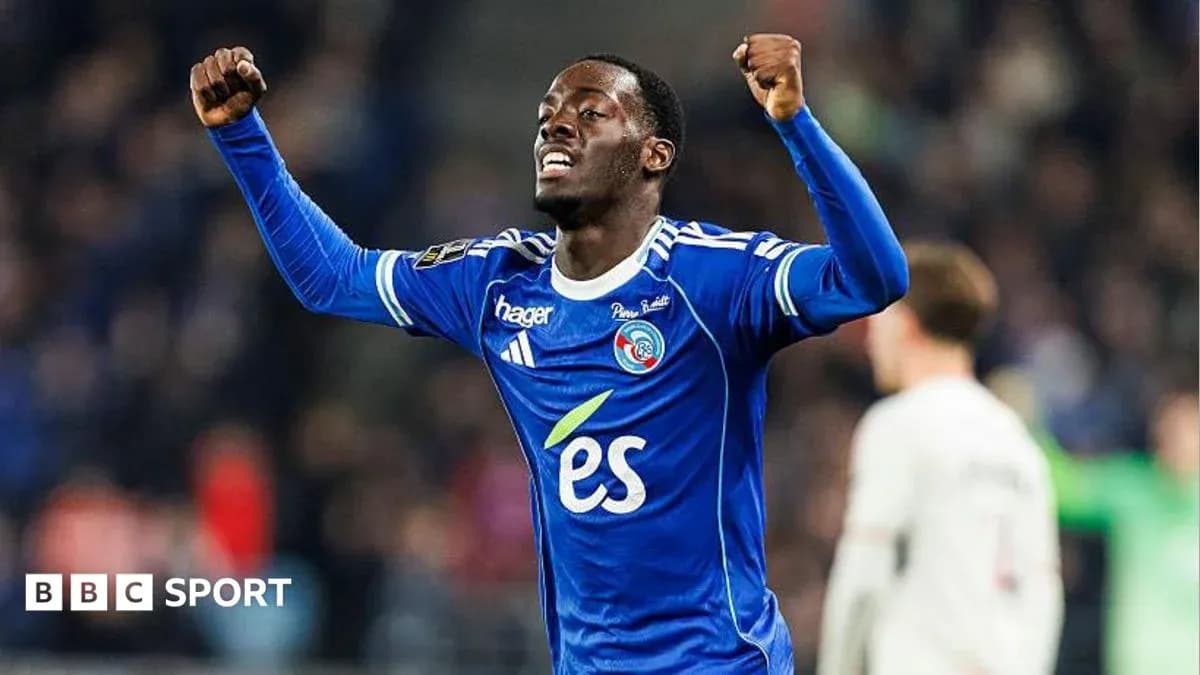 Player celebrating in blue jersey after scoring Player celebrating in blue jersey after scoring