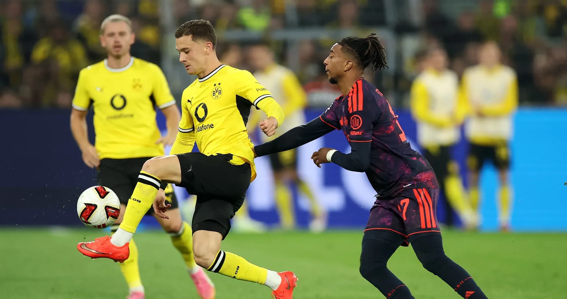 Player attempting to control the ball during match Player attempting to control the ball during match