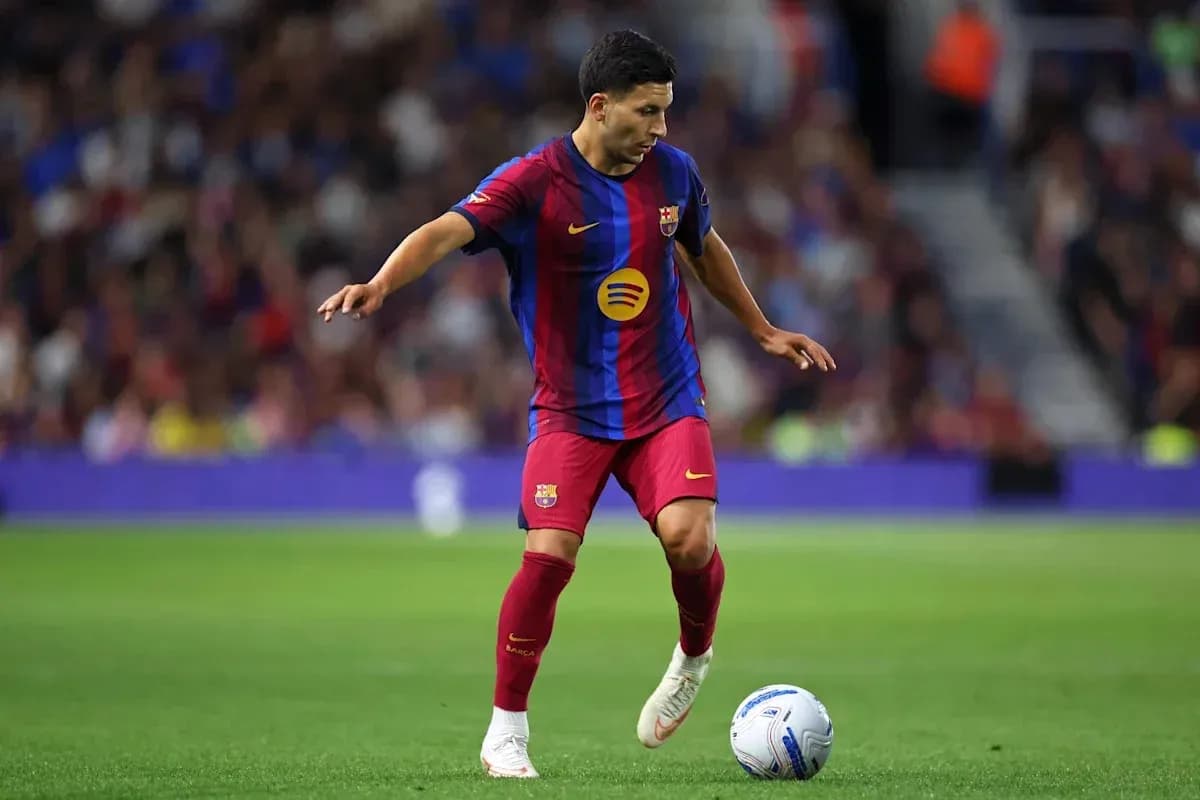Player dribbling the ball on the pitch Player dribbling the ball on the pitch