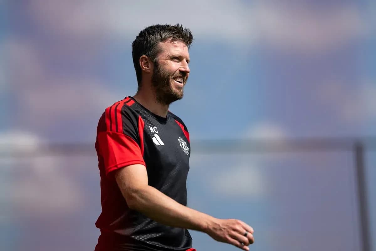 Coach smiling during training session at pitch Coach smiling during training session at pitch