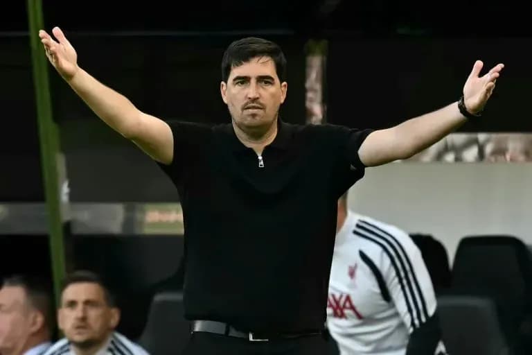 Coach gesturing during a match from the sideline Coach gesturing during a match from the sideline