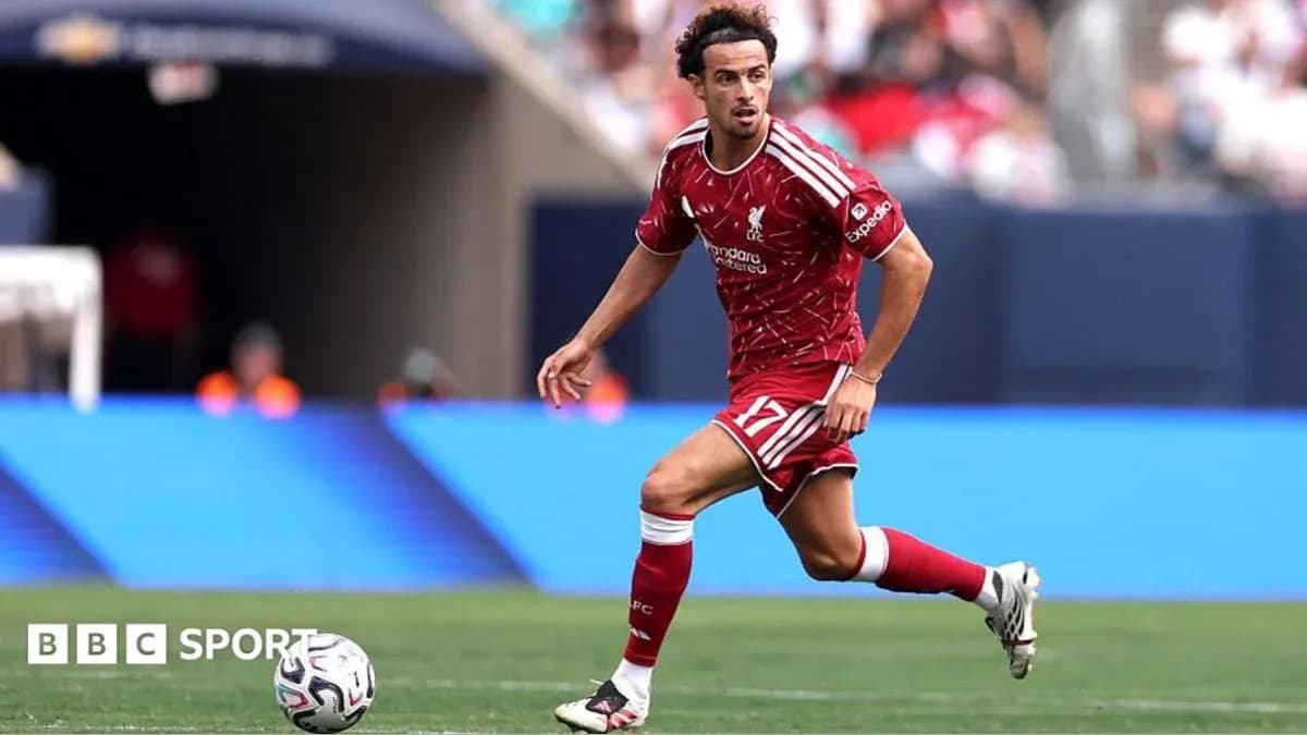 Player in red kit running with the ball Player in red kit running with the ball