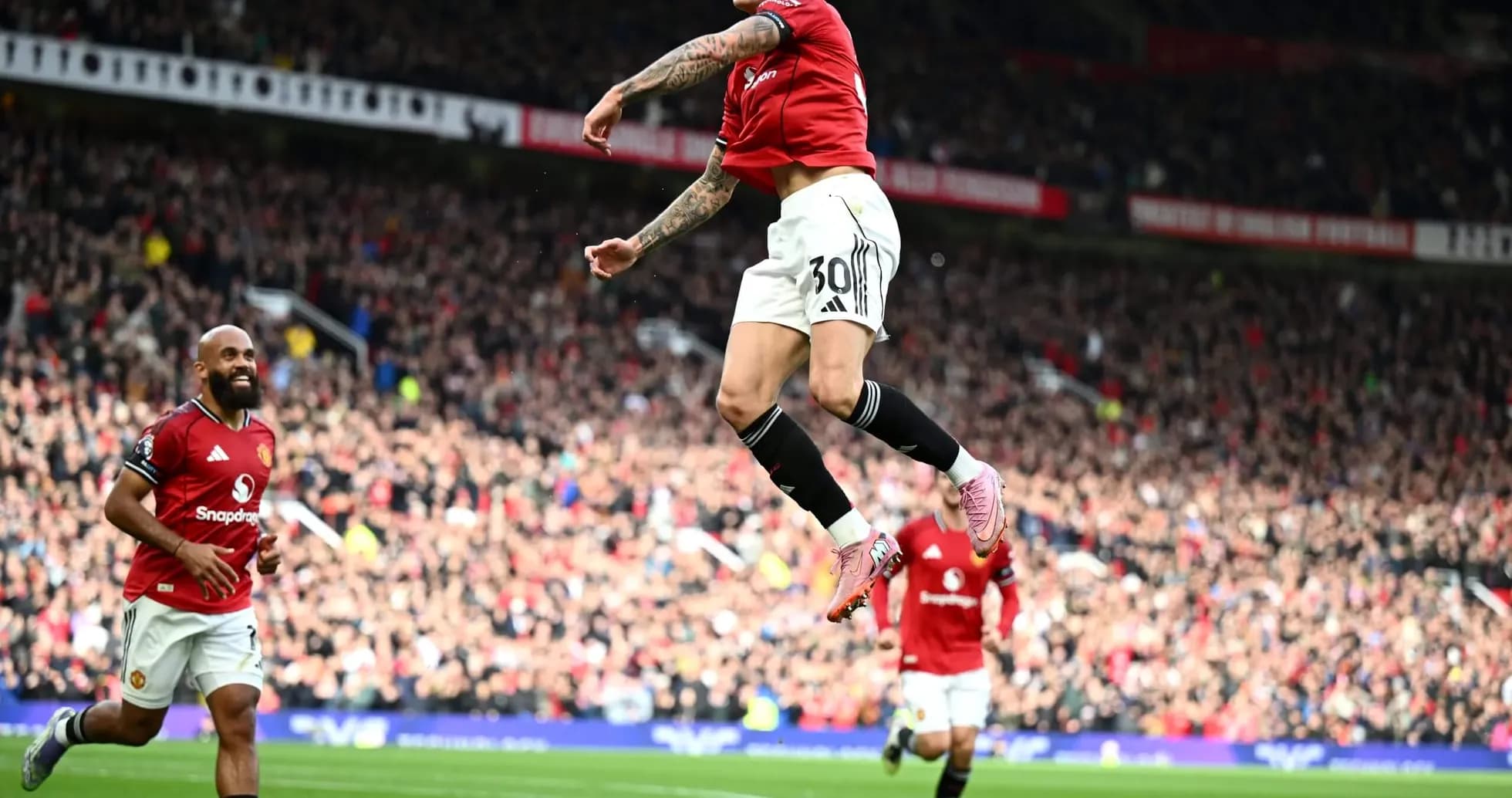 Manchester United player celebrating a goal Manchester United player celebrating a goal