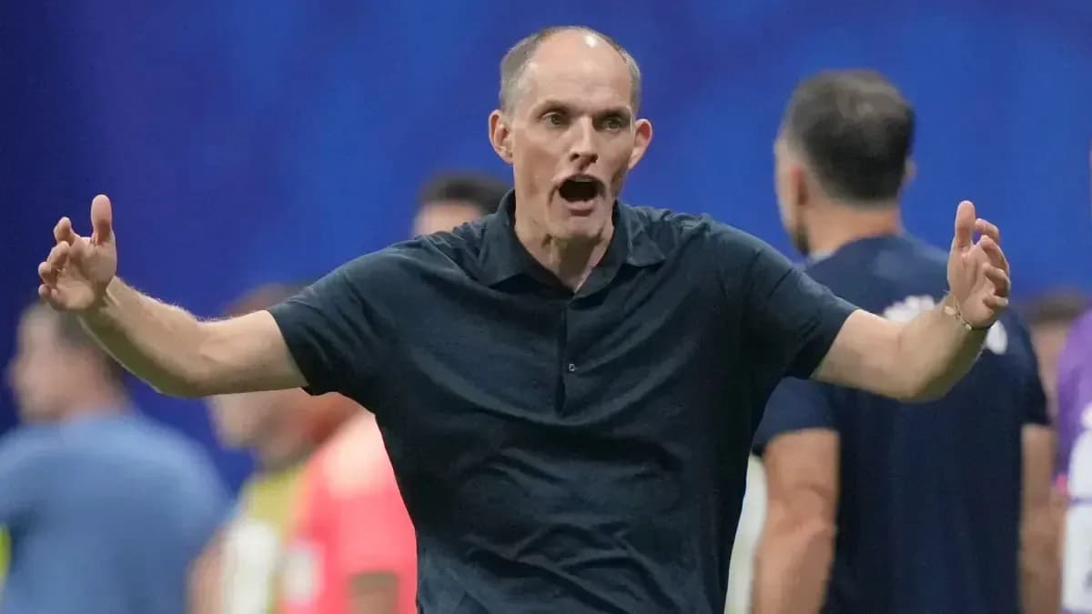 Coach gesturing passionately on the sidelines during match Coach gesturing passionately on the sidelines during match