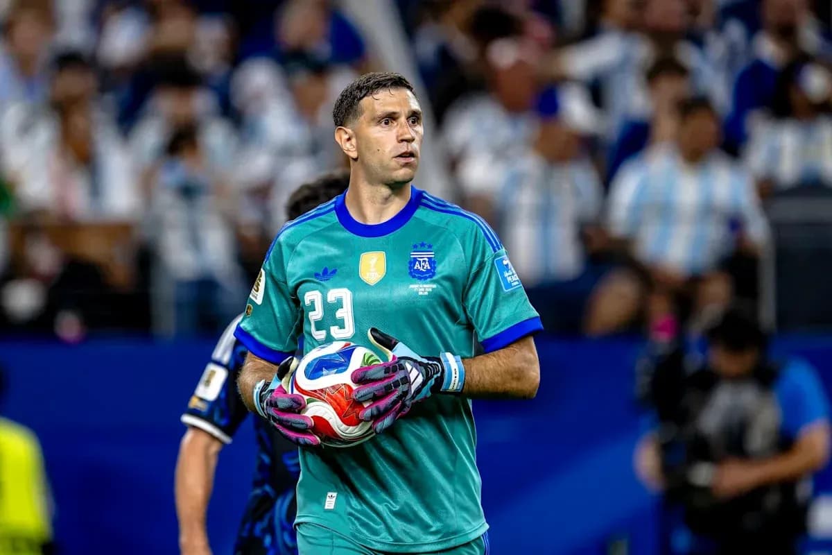 Goalkeeper in green kit holding a soccer ball Goalkeeper in green kit holding a soccer ball