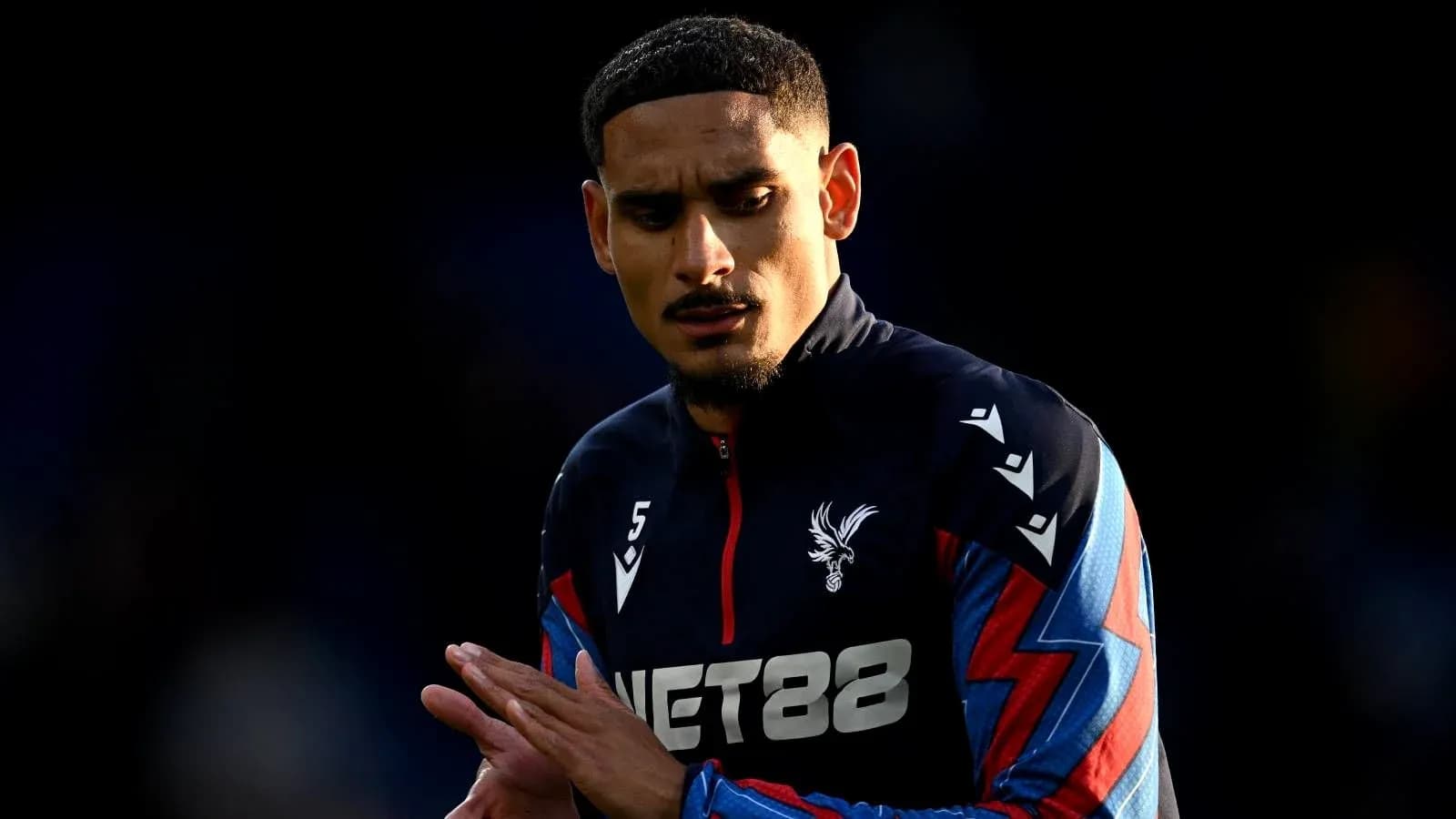 Player warming up in Crystal Palace training kit Player warming up in Crystal Palace training kit