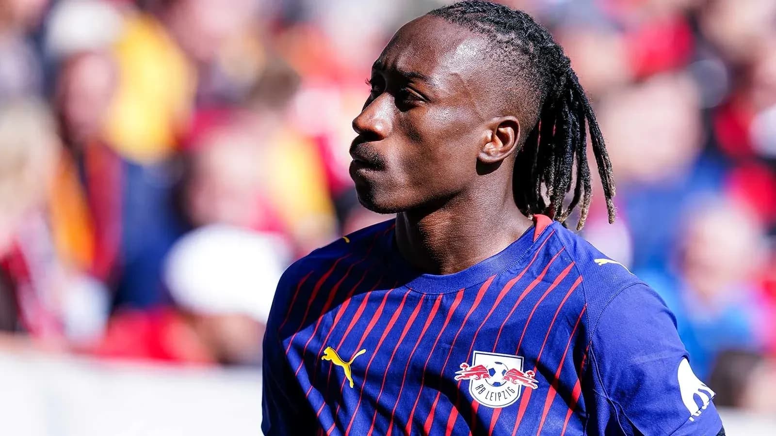 Player in RB Leipzig jersey on the field Player in RB Leipzig jersey on the field