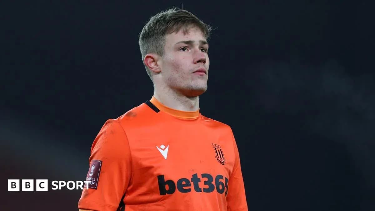 Goalkeeper in orange kit during match Goalkeeper in orange kit during match