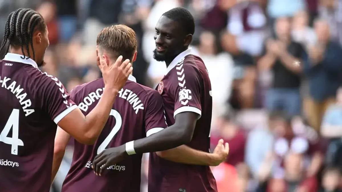 Heart of Midlothian players celebrating together Heart of Midlothian players celebrating together