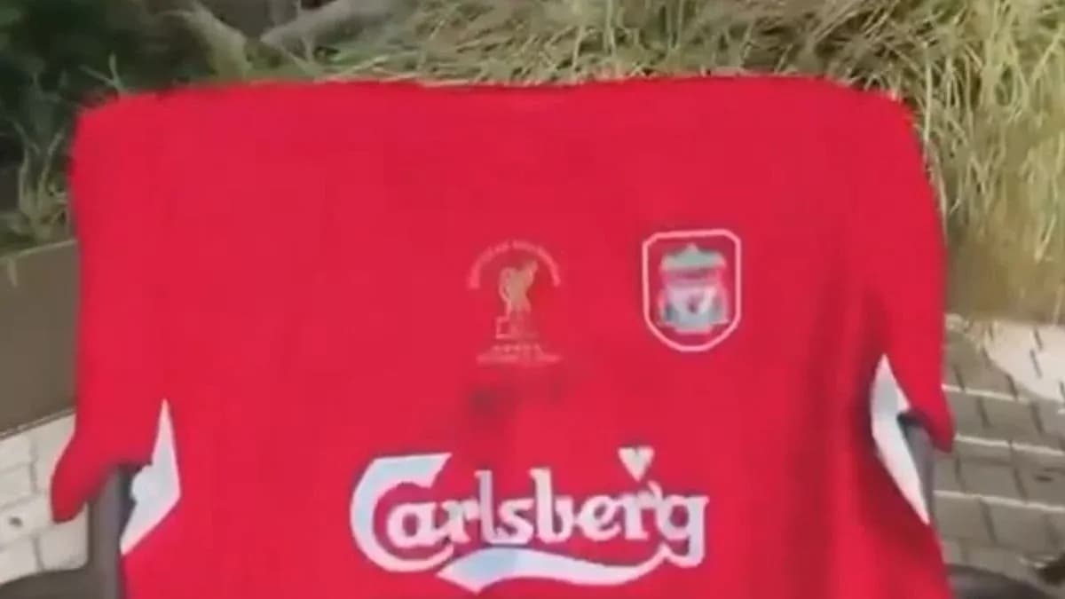 Red Liverpool jersey with Carlsberg logo displayed Red Liverpool jersey with Carlsberg logo displayed