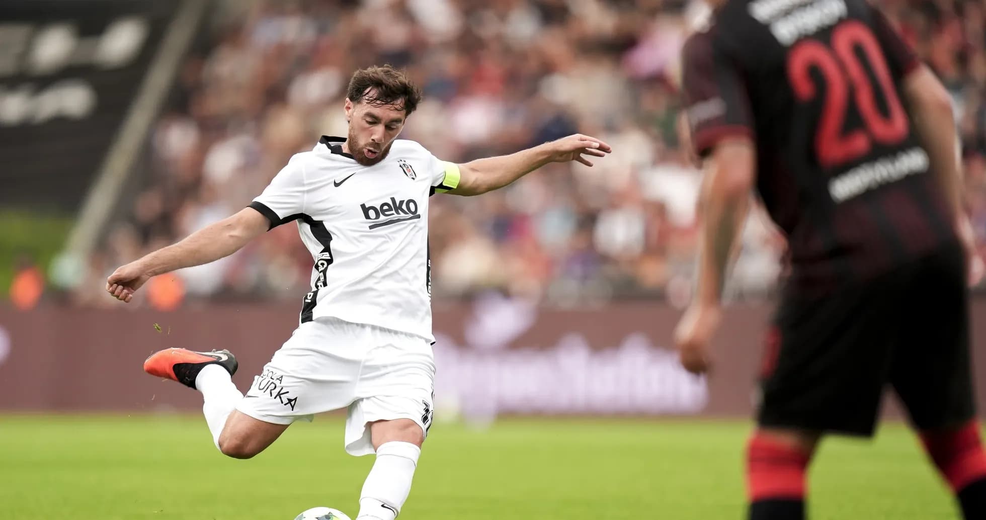 Beşiktaş player kicking the ball during match Beşiktaş player kicking the ball during match