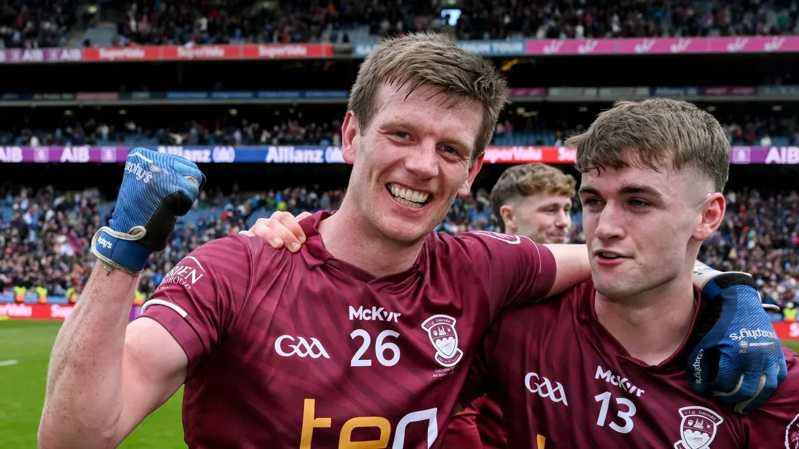 Two players celebrating on the field after match Two players celebrating on the field after match