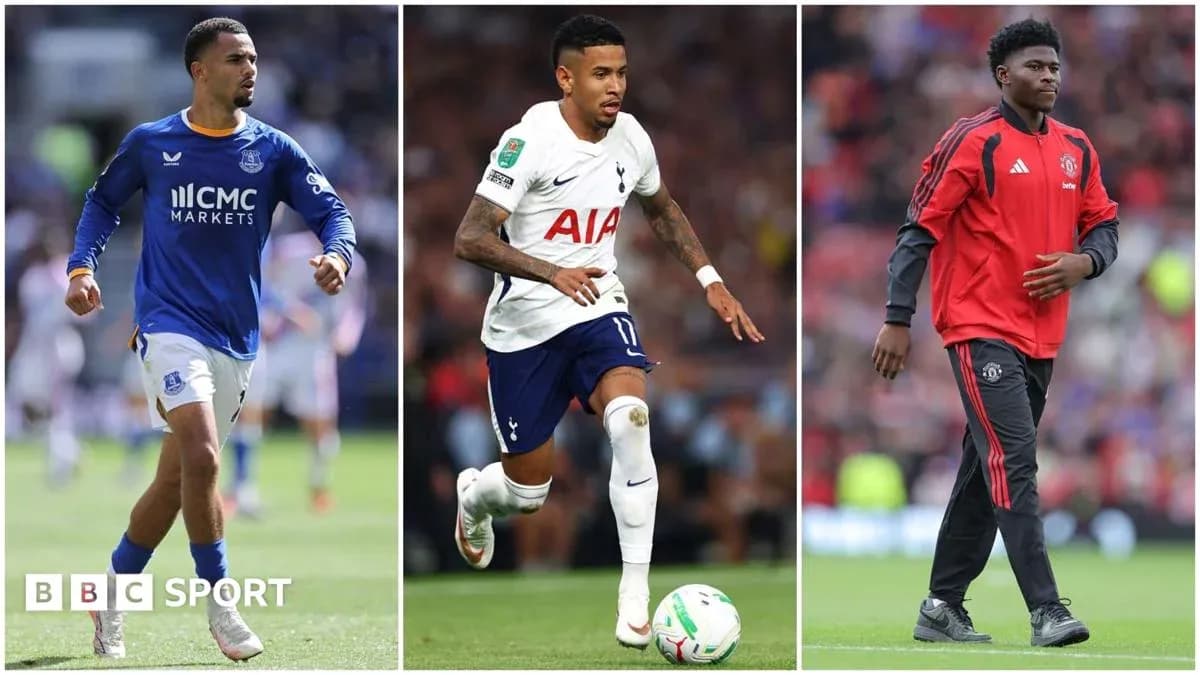 Three football players in club kits on pitch Three football players in club kits on pitch