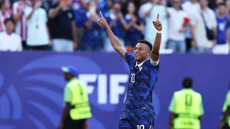 Player celebrating a goal with raised hands Player celebrating a goal with raised hands