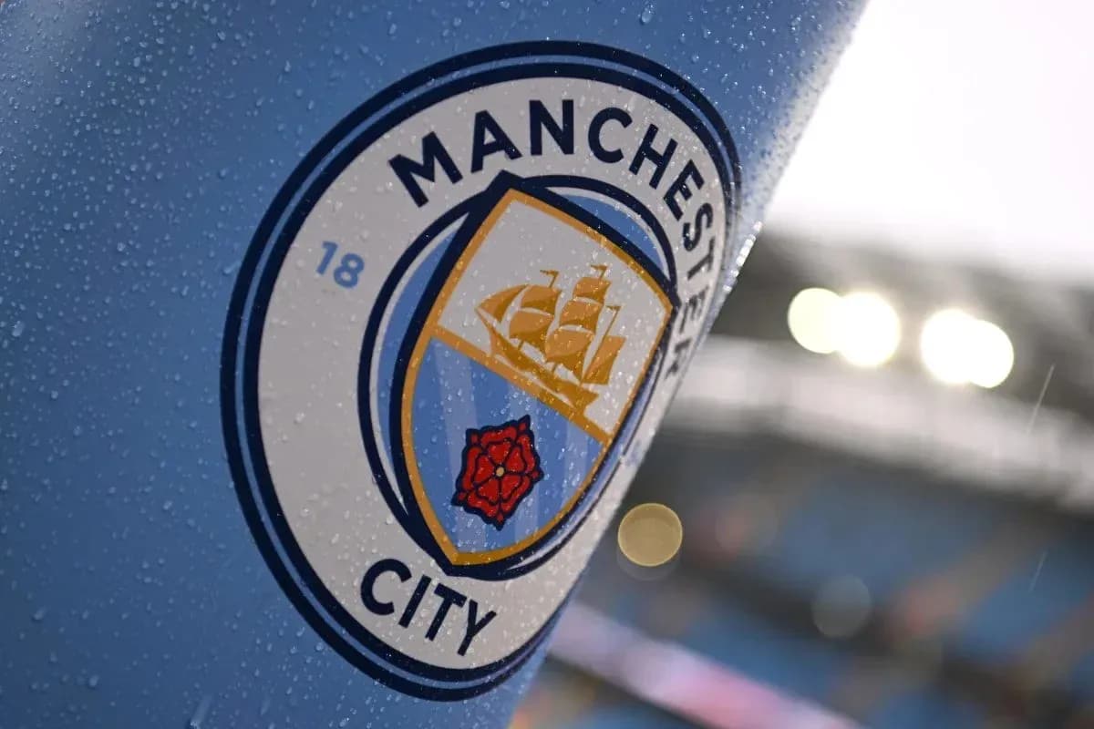 Close-up of Manchester City club emblem with raindrops Close-up of Manchester City club emblem with raindrops
