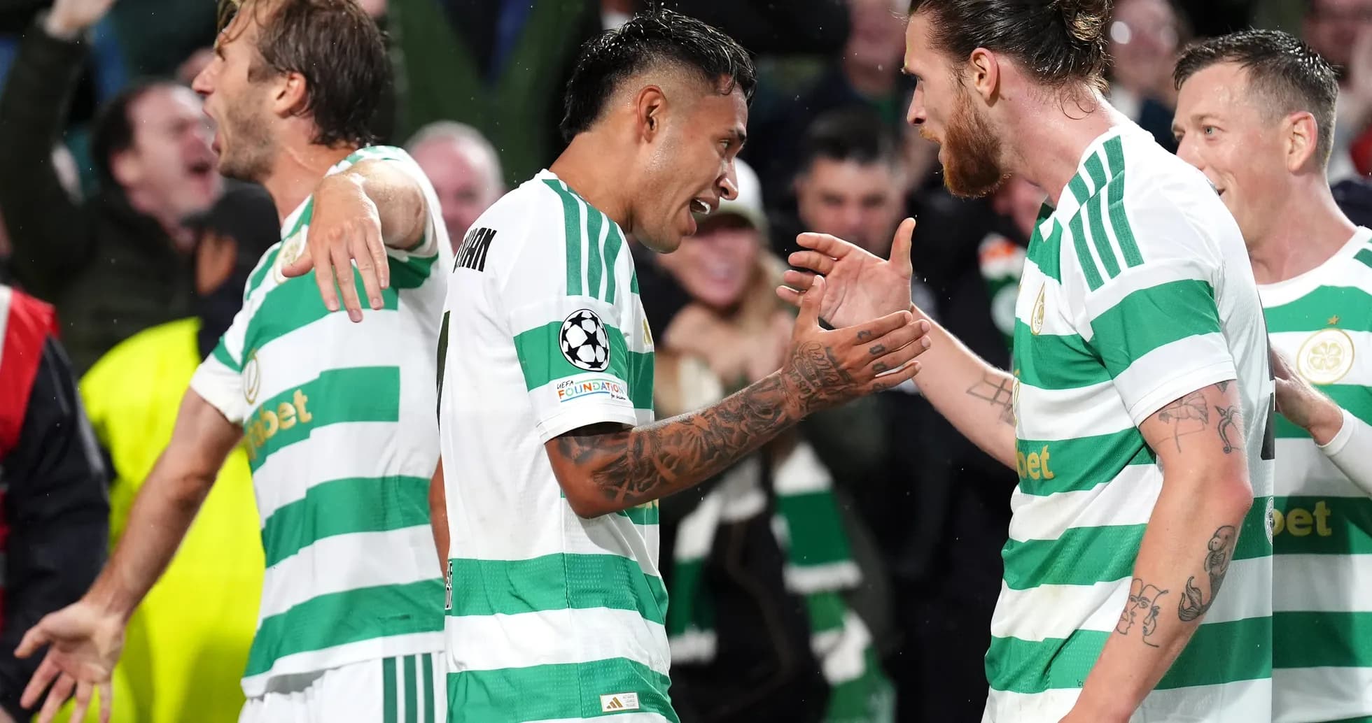 Celtic players celebrating a goal during match Celtic players celebrating a goal during match